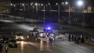 Police checkpoint near Cairo-Alexandria agricultural road during two-week Corona curfew