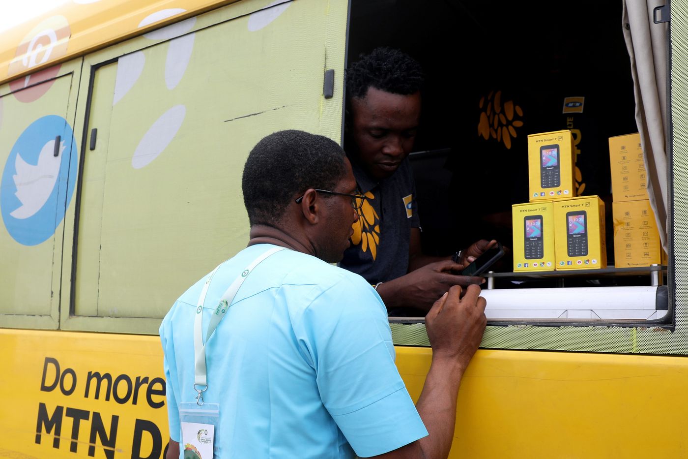 An MTN customer care staff attends to a client in an MTN service bus in Lagos, Nigeria August 28, 2019. 