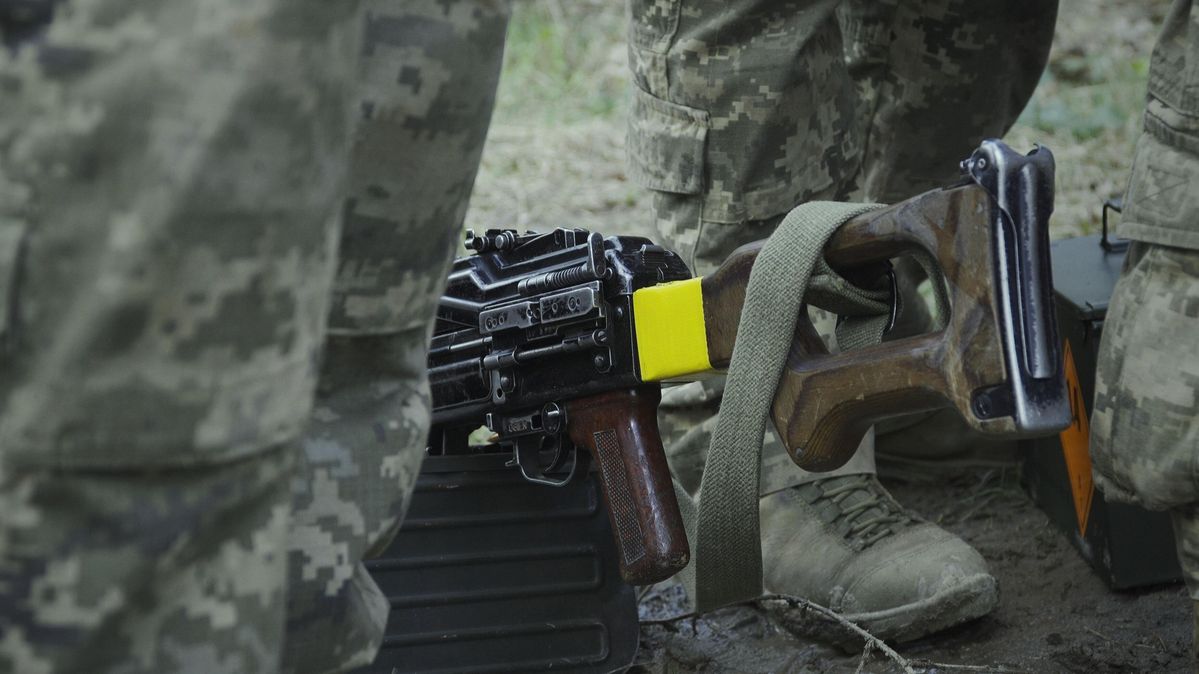 Close-up view of a soldier's shoes and trousers