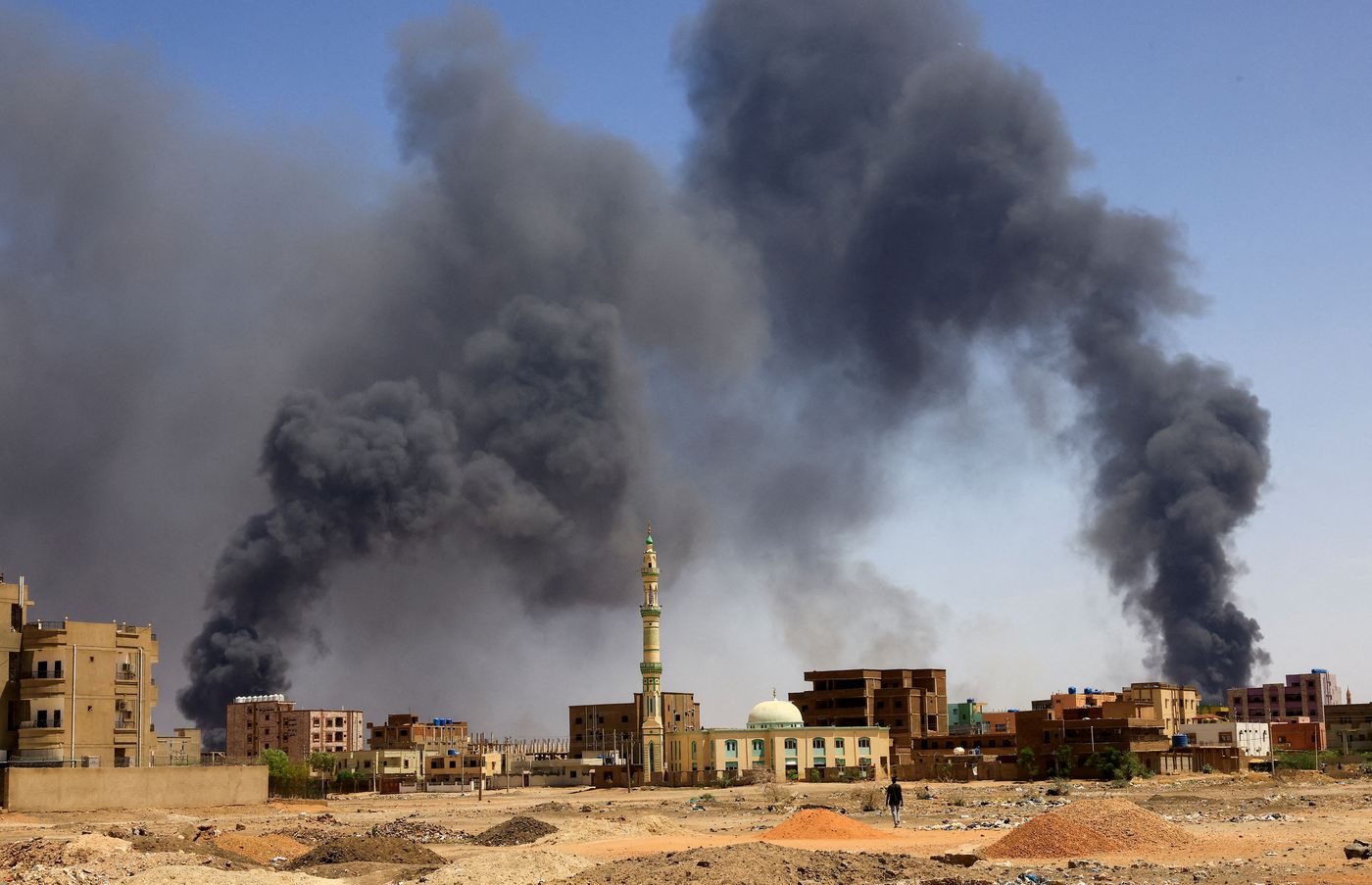 Khartoum North, Sudan, May 1, 2023: Smoke billows from buildings after aerial bombardments.