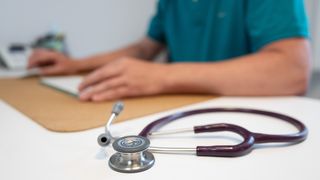 A stethoscope on a desk 