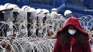 Polish police officers stand guard at the Polish-Belarusian border