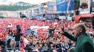Turkish President Recep Tayyip Erdogan addresses the crowd during election rally in Ankara.