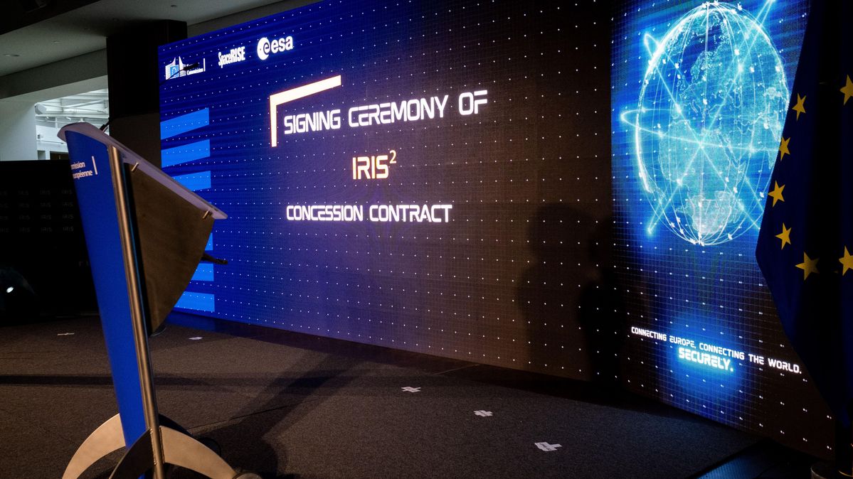 A large screen with "signing ceremony"