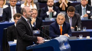 Manfred Weber of the European People's Party stands at the lectern in the European Parliament.